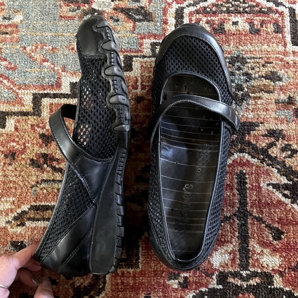 Black mesh Skechers flats